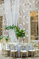 Celebration hall with gold tropical decor