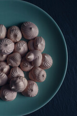 Pink mini meringues on a plate