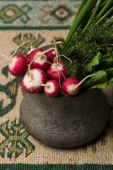 Greens and radish on national rug