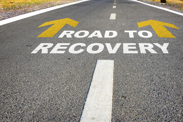Road to recovery words on road. Economic recovery concept and business challenge idea