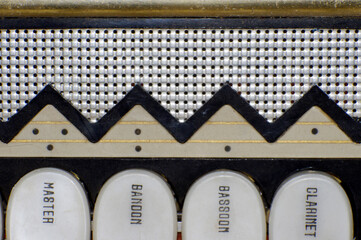 close up of vintage accordion keys and buttons 