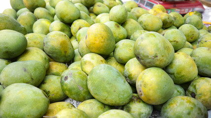 Local Street Vendor selling Ripe Mangoes at street on a van in Dhaka, Bangladesh.