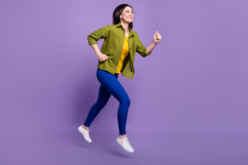Fototapeta na wymiar Full body profile side photo of young girl happy positive smile jump run speed hurry sale isolated over violet color background