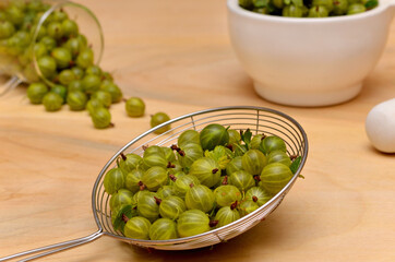 green agrus berries close-up on the table
