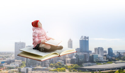 Little girl reading a book