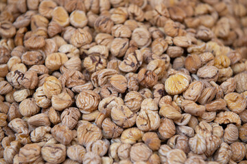 Dried chestnuts are solding in outdoor market, Sicily, Italy