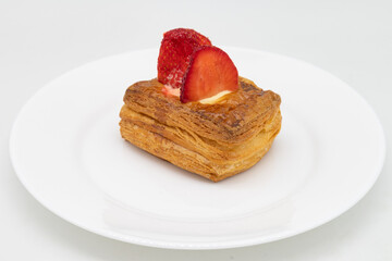 Small Strawberry Pastry on a White Plate