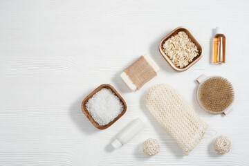 Spa still life background. Set for body care. Bottles with gel and shampoo, soap, sea salt, washcloth for bath.