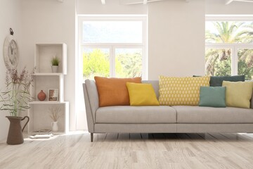 White living room with sofa and summer landscape in window. Scandinavian interior design. 3D illustration