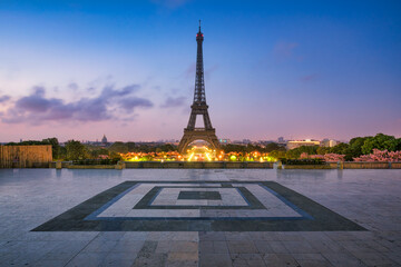 Paris skyline at dusk with Eiffel Tower seen from Place du Trocadero