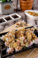 Lupis and Cenil is Traditional Indonesia snack. Lupis and Cenil can be sweetened more with shredded coconut topped with a thick palm sugar syrup.  It's often found in traditional markets.