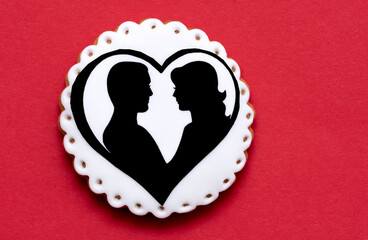 woman and man in a white hart, on a red background
