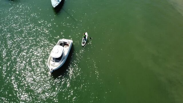 Birds Eye View Of Paddle Boarders Having Fun On A Sunny Morning In The South Of England