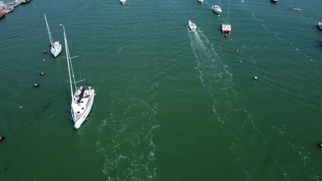 large sailing boats catching the wind below the camera