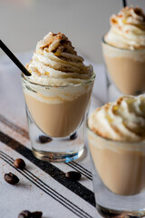 White Russian. Dessert Cocktail. Alcoholic Drinks made with gin, vodka, rum or whiskey mixed with soda water, fruit juices and garnishes with limes and cherries. Classic American bar drinks.