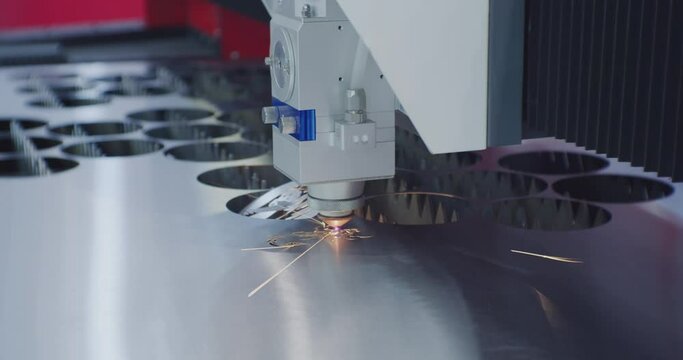 modern industrial equipment.Automatic cnc laser cutting machine working with sheet metal.technological process close-up.