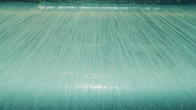 Plenty of threads getting woven at high speed
