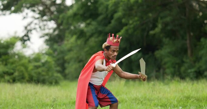 Hero man in red with crown holding sword