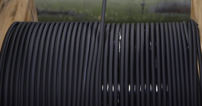Industrial cable production, winding of an insulated black cable