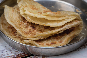 Indian paratha flat breads on metal plate