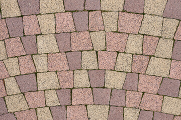 Stone block pavement. Brown paving slabs, close up. Pattern of paving blocks, top view