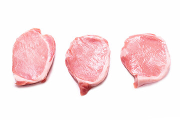 Raw pork pieces isolated on a white background.