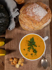 Pumpkin broth on wooden background