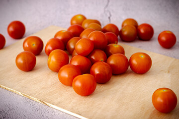 Fototapeta na wymiar Super red Cherry tomatoes on white background