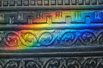 Detail of vintage cast iron floor or pavement with solar bunnies, plashes of sunlight....