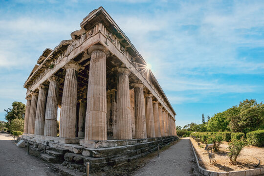 Athens, Attica, Greece. The Temple of Hephaestus or Hephaistos (also Hephesteum, Hephaisteion) is an ancient greek temple at the archaeological site of Agora of Athens. Sun, sunstar, sunrays, day