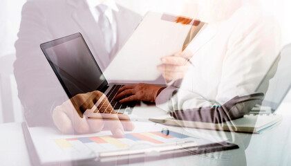 Digital marketing media in virtual screen.businesswoman hand working with mobile phone and modern compute with VR icon diagram at office in morning light
