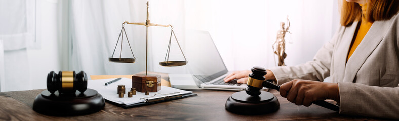 Business and lawyers discussing contract papers with brass scale on desk in office. Law, legal services, advice, justice and law concept picture with film grain effect