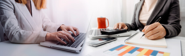 Businesswoman use laptop ,analytics and financial and bank technology concept, chart from computer laptop,Business growth concept