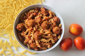 Air fried meat balls in tomato sauce pasta. Home made.
