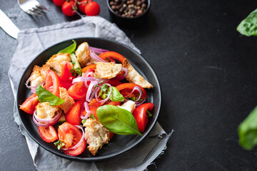 tomato vegetable salad panzanella veggie croutons, olive oil, rusk healthy food meal snack copy space food background  vegan vegetarian food