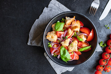 tomato vegetable salad panzanella veggie croutons, olive oil, rusk healthy food meal snack copy space food background  vegan vegetarian food