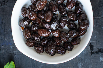 olives dried sun-dried tasty olive dry fruit appetizer salad addition on the table healthy food meal snack copy space food background rustic 