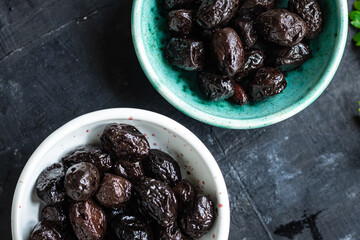 olives dried sun-dried tasty olive dry fruit appetizer salad addition on the table healthy food meal snack copy space food background rustic 