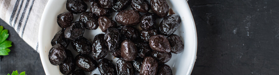 olives dried sun-dried tasty olive dry fruit appetizer salad addition on the table healthy food meal snack copy space food background rustic 