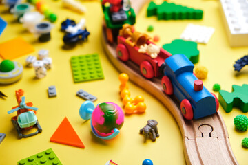 Fototapeta na wymiar Set of different children's toys, wooden railroad