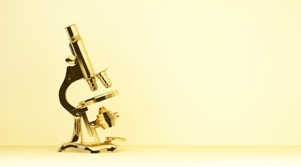 gold retro microscope on yellow background