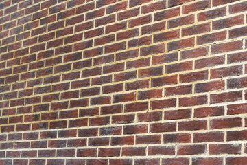 Brick texture. The wall is made of red bricks.