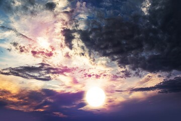 colorful sky with sun in clouds of altitude . religious background sunset or dawn , 