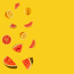 fresh lemon, watermelon and grapefruit on the illuminating yellow background. tropical summer abstract art. minimal flat lay
