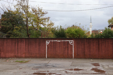 Painted football goal post on a wall football goal painted on a wall in a poor neighbourhood in...