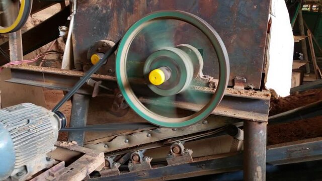 motor of a dirt conveyor belt in an old brick factory