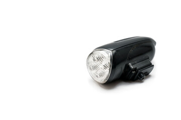 Bicycle headlight . Used bicycle headlight on isolated white background background. Selective focus. Space for text. black flashlight isolated on white