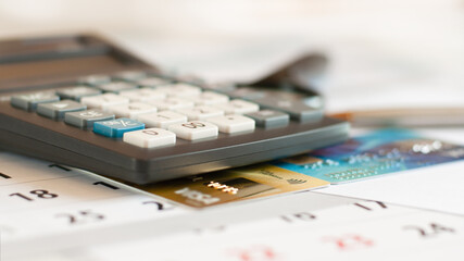 business with credit cards on calculator office desk white background, close up