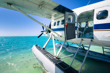Cool old hydroplane with open door sitting on a sandy beach. Beautiful summer day in Dry Tortugas,...