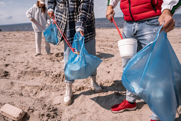 volunteers collecting garbage in trash bags
